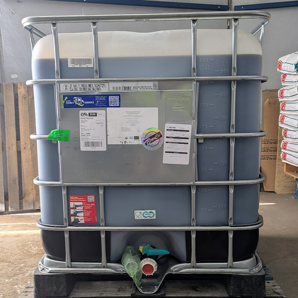 A large plastic drum labeled with the 'Best Ground' brand, containing organic raw 100% blue agave syrup.