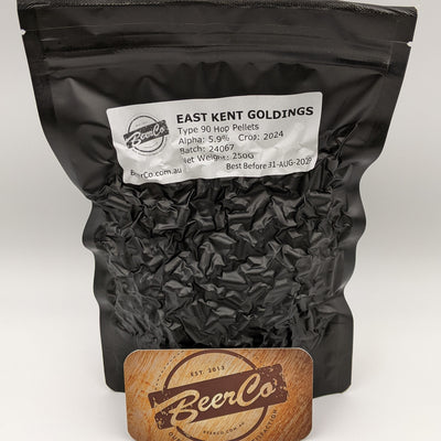 Black bag of East Kent Goldings hop pellets with a visible label and BeerCo branding.