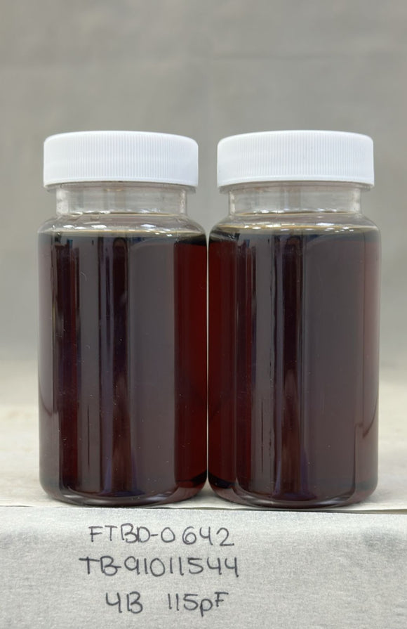 Two glass jars with white lids containing Dark Agave Syrup