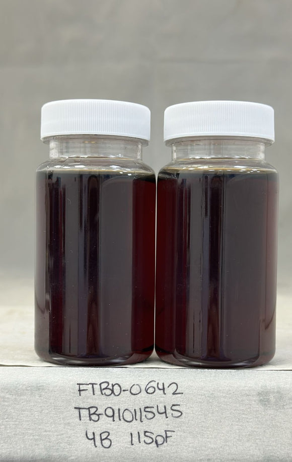 Two glass jars with white lids containing Dark Agave Syrup