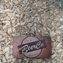BeerCo branded ginger kibbled product placed on a background of dried ginger kibbled.