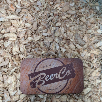 BeerCo branded ginger kibbled product placed on a background of dried ginger kibbled.