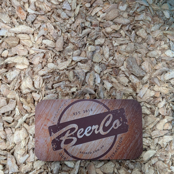 BeerCo branded ginger kibbled product placed on a background of dried ginger kibbled.