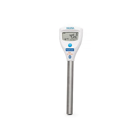 Digital thermometer with a white body and silver base on a white background