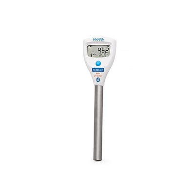 Digital thermometer with a white body and silver base on a white background