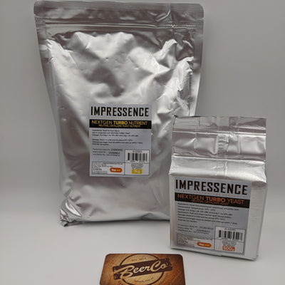 Two silver foil bags of Impressence Next Gen Turbo Yeast, one large 1kg bag and one smaller 500g bag, displayed on a light gray background with a BeerCo coaster in the foreground.