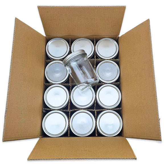 Cardboard box with glass jars inside on a white background