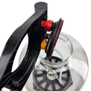 Close-up of a metallic object with black and red components on a white background