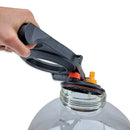 Hand using a black and red tool to open a clear plastic container on a white background