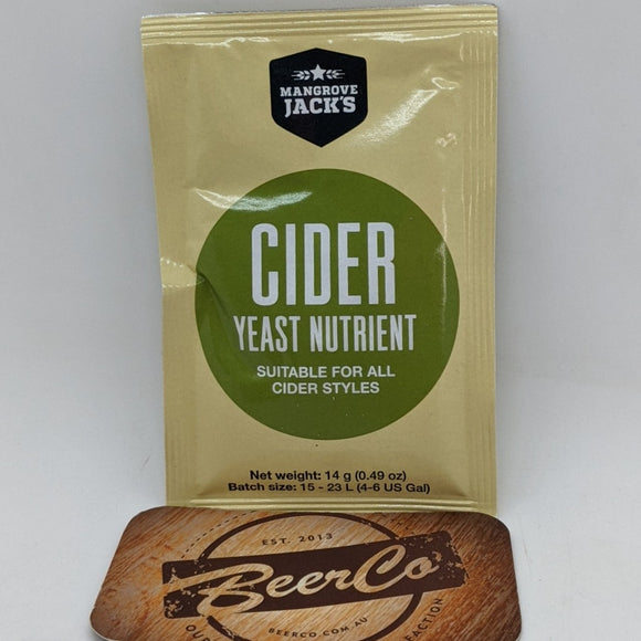 A sachet of Mangrove Jack's Cider Yeast Nutrient placed on a wooden surface with a branded object in the background.