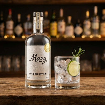 Bottle of 'Mary London Dry Gin' with a cocktail in a glass on a wooden surface, against a backdrop of other bottles.