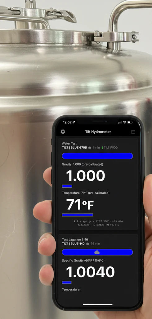 Phone displaying brewing software on a metal tank background