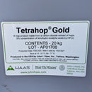 Tetrahop Gold container with label on a gray background