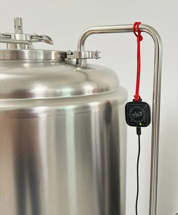 Metal tank with a TILT device attached on a white background