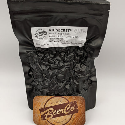 Black bag of Vic Secret hop pellets with a BeerCo branded card on a white background