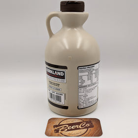 Kirkland maple syrup bottle with a coaster featuring 'BeerCo' on a white background