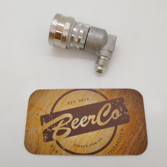 A stainless steel ball lock keg disconnect with threaded fitting, displayed on a wooden surface with a 'BeerCo' branded coaster.